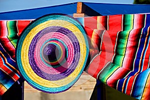 Colorful straw hat and blanket