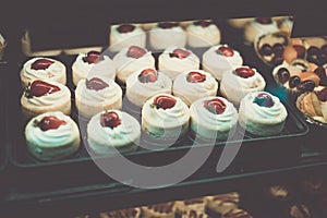 Colorful strawberry cakes selling in shop at Granville island public market