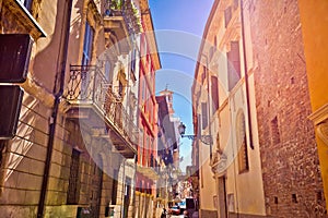 Colorful street of Verona in sun haze view