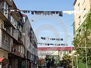 Colorful street. Yard with stretched clotheslines. Clothes are dried in the yard. Quiet backyard of Georgia