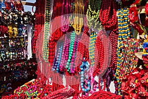 Colorful strings of semiprecious, wooden and glass