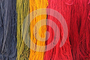 Colorful strings of yarn at store