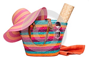 Colorful striped beach bag with a hat sun mat towel and sunglasses