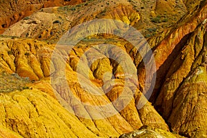 Colorful striped mountains, yellow and different color painted hills
