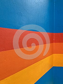 Colorful stripes painted on blue background