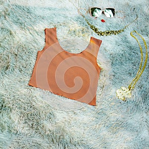 Colorful Stylish female summer strapless outfit on grey fur background