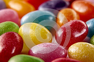 Colorful sugar-coated candies in an array of vibrant hues and smooth textures, creating a cheerful and inviting visual perfect for