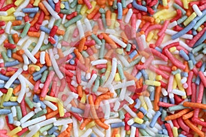 Colorful sugar strands sprinkles abstract background