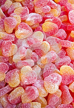 Colorful sugary candy heart shape background jelly candies