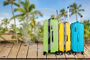 Colorful suitcases stack on nature background