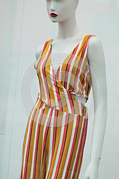 colorful summer clothes on mannequin  in women fashion store showroom