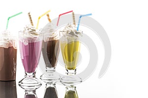 Colorful summer milkshake with take away cup wit reflection