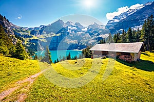 Colorful summer morning on the unique Oeschinensee Lake. Splendid outdoor scene in the Swiss Alps with Bluemlisalp mountain, Kande