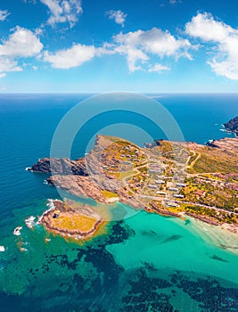 Colorful summer view from flying drone of Falcone cape and Torre della Pelosa tower.