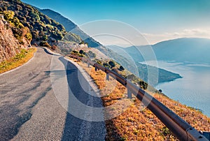 Colorful summer view of Kephalonia island with asphalt road, Greece, Europe.