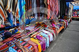 Colorful Sunday market in Otavalo, Ecuador photo