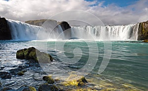 Colorful sunrise on Godafoss waterfall on Skjalfandafljot river, Iceland, Europe