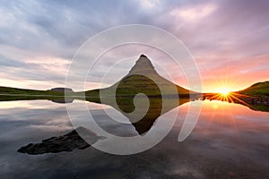 Colorful sunrise on Kirkjufellsfoss waterfall