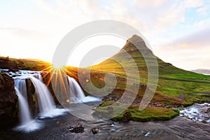 Colorful sunrise on Kirkjufellsfoss waterfall