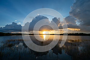 Colorful sunrise over pond in Everglades National Park.