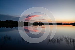 Colorful sunrise over pond in Everglades National Park.