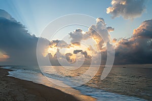 Colorful sunrise on the sea coast. Beautiful clouds