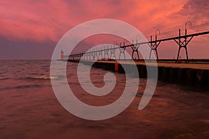 Colorful sunrise sky with lighthouse