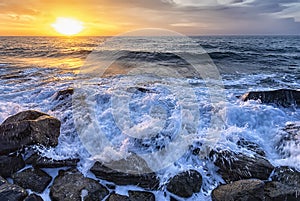 The colorful sunrise sky at the rocky coastline of the Black Sea