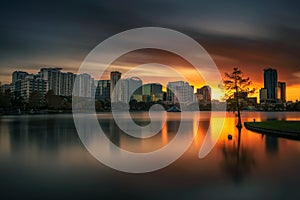 Colorful sunset above Lake Eola and city skyline in Orlando, Florida photo