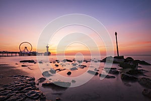 sunset on coastline, beach, pier and ferris wheel, Scheveningen, the Hague