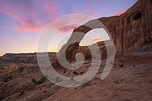 Colorful sunset at Corona Arch in Moab Utah