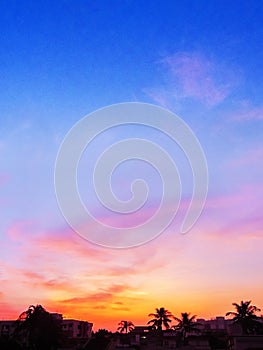 Colorful Sunset country side silhouette of coconut trees at the
