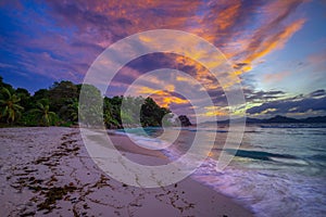 Colorful sunset over Anse Severe Beach at the La Digue Island, Seychelles