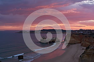 Colorful sunset over the Atlantic Ocean. Praia do Amado, Algarve, Portugal
