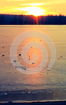 Colorful sunset over frozen lake