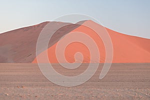 Colorful sunset over the Namib desert, Namibia, Africa. Scenic sand dunes in backlight in the Namib Naukluft National Park, Swakop