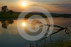 Colorful sunset over the river suburban area of central Russia