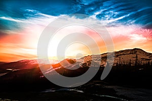 Colorful sunset over the ski resort in the mountains