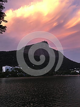 Colorful sunset under christ the redeemer at Rio de Janeiro - Brazil photo