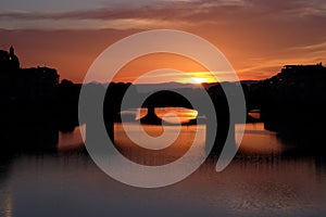 Colorful sunset view from Arno river in Florence, Italy.