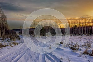 Colorful sunset in the winter forest. Beautiful winter landscape in the mountains. Sunrise