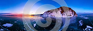 Colorful sunset on winter lake Baikal near an island covered with ice. . Cylindrical panorama 360