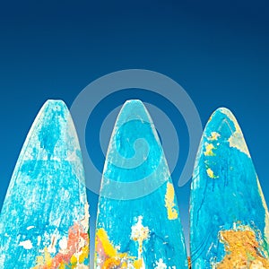 Colorful surfboards close-up. Artistic grunge style. Beautiful tourist background.