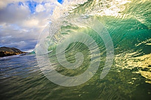 Colorful Surfing Wave Lit with sunlight in Oahu Hawaii USA