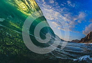 Colorful Surfing Wave Lit with sunlight in Pacific Ocean in Maui