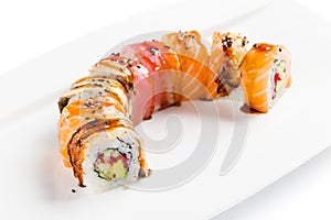 Colorful sushi roll with salmon, eel, tuna, avocado, cucumber, c