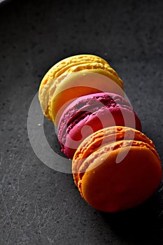 Colorful sweet cookies background with copy space.