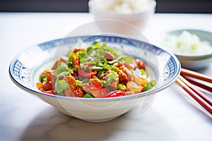 colorful sweet and sour pork with red and green peppers