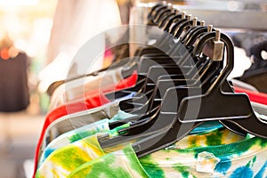 Colorful T-shirt on the clothes rack