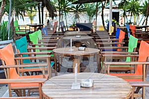 Colorful Table and chairs in beach bar restaurant, near sea